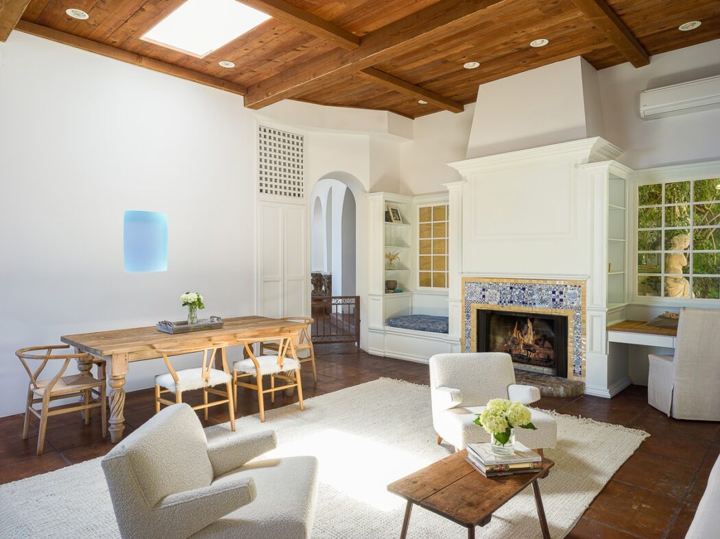 Anthony Kiediss Dining beside Fireplace