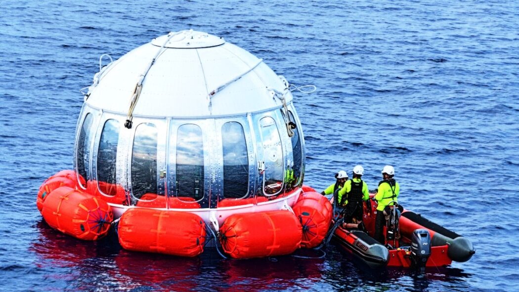 The retrieval crew with the capsule after splashdown